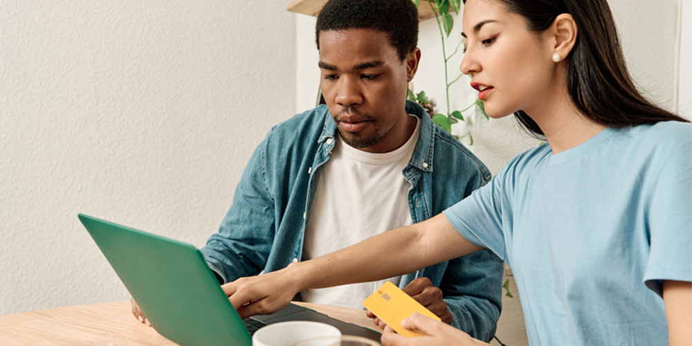 man-and-woman-buying-online man-and-woman-buying-online